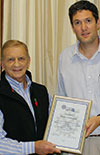 Walter Zimmerman (l) was presented with a certificate by Eugene Tondolo (r) recognising his outstanding contribution to the fluid power industry. 